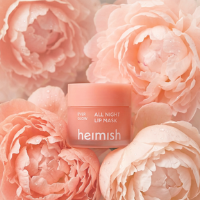 Heimish lip mask jar surrounded by pink roses