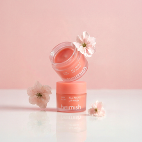 Heimish All Night Lip Mask with pink flowers on a light pink background